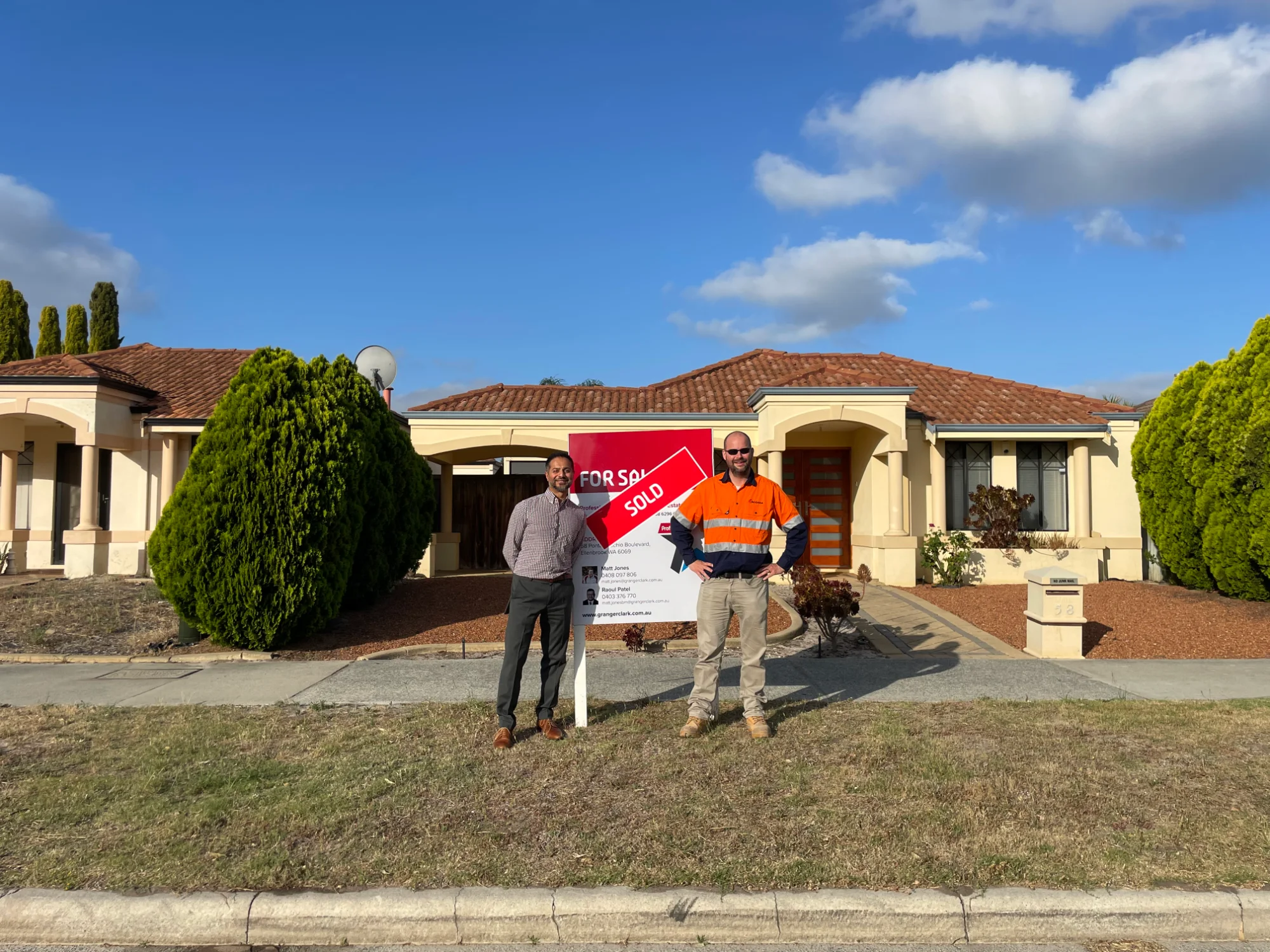 Jay from Edge Property Solutions with a client outside a recently sold property